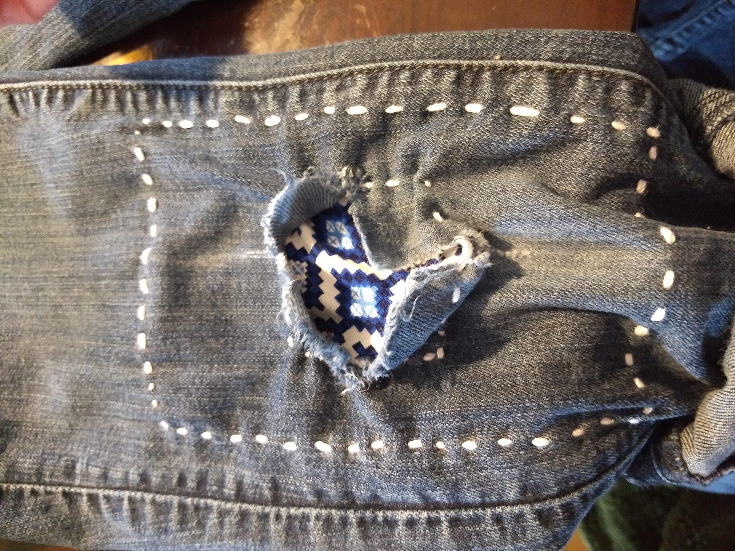 Mending knee holes with sashiko