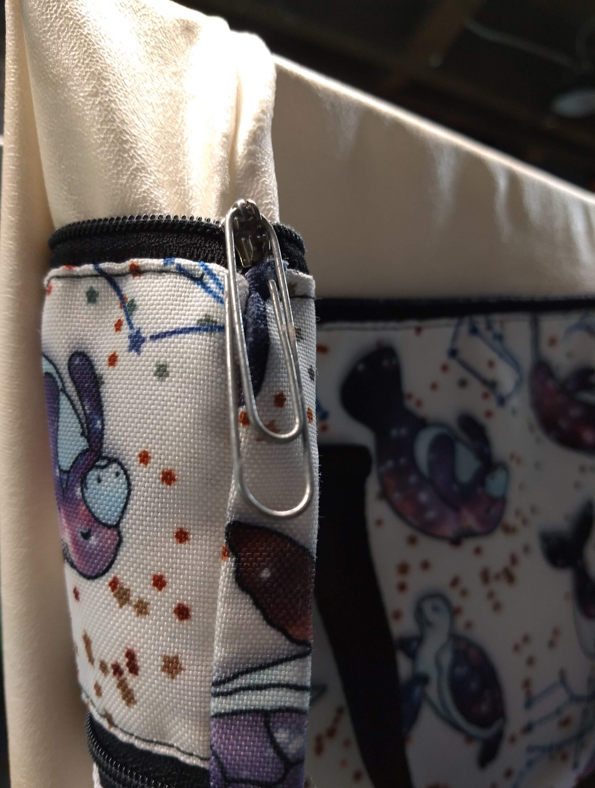 Drilling through a broken zipper slider and adding a paperclip pull
